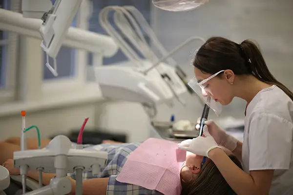 restorative-dentistry-1 Dentist performing a restorative dental procedure